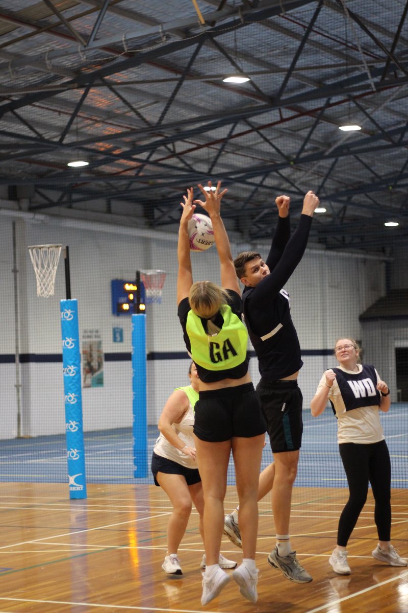 Newbies jumping for the ball at a Just Play netball game