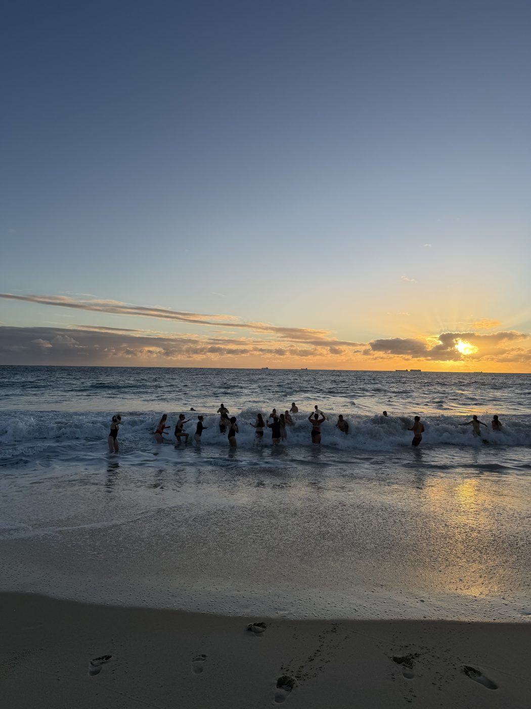 Sunset dip in the ocean