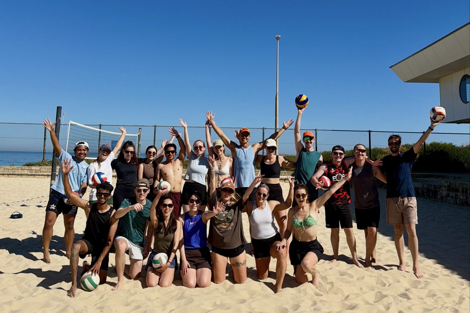 Beach volleyball group cheering