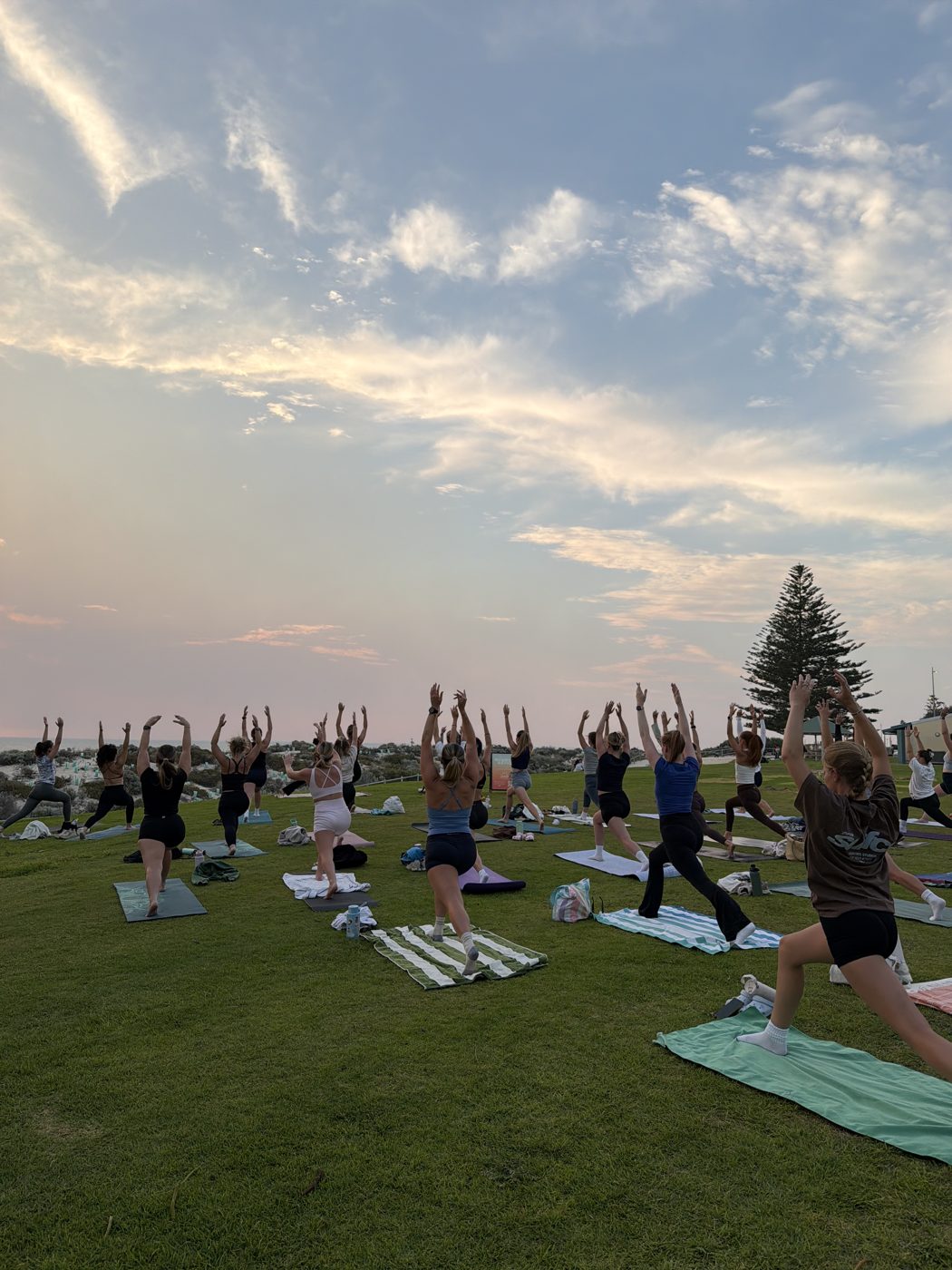Sunset yoga on the grass